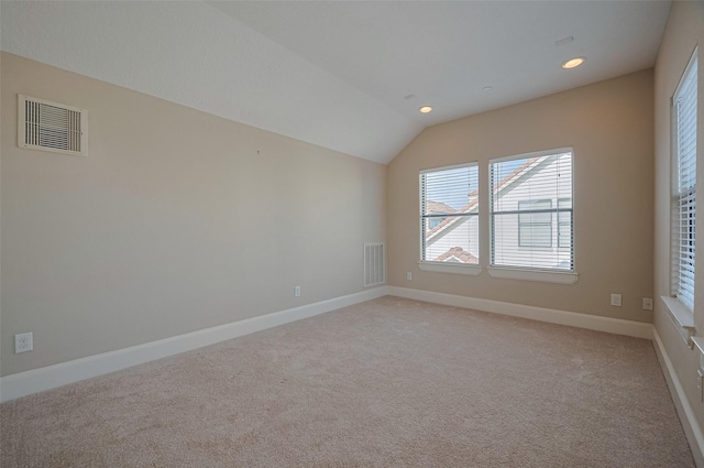 empty room with visible vents, light carpet, and recessed lighting