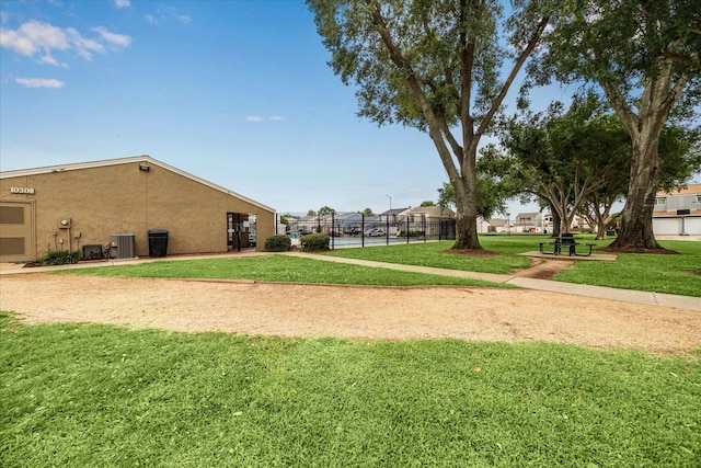 10314 Sommerville Ave, Houston, TX 77041 - view of home's community featuring a lawn and fence