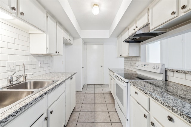 10314 Sommerville Ave, Houston, TX 77041 - kitchen with white cabinets, decorative backsplash, and white range with electric cooktop