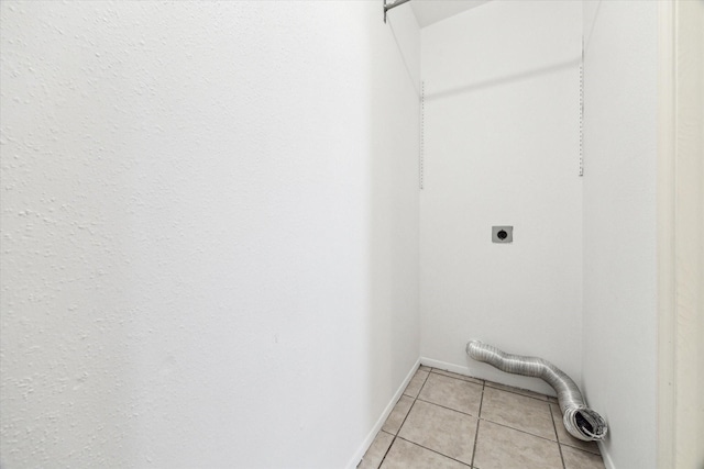 10314 Sommerville Ave, Houston, TX 77041 - laundry room featuring light tile patterned floors, hookup for an electric dryer, laundry area, and baseboards
