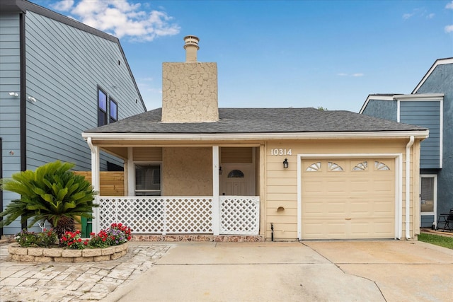 10314 Sommerville Ave, Houston, TX 77041 - view of front of home featuring an attached garage, a chimney, a shingled roof, a porch, and driveway