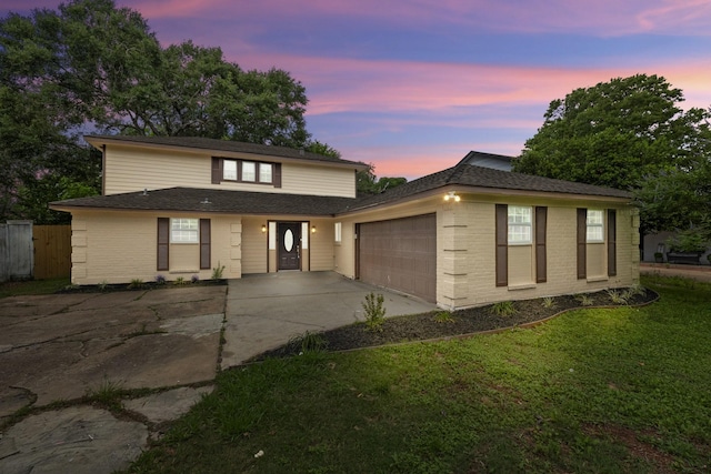1819 Redwood Ct, Sugar Land, TX 77498 - view of front facade featuring concrete driveway, brick siding, fence, and a garage