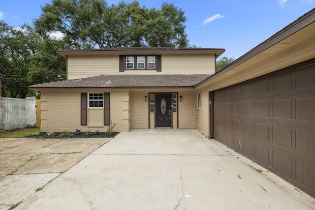 1819 Redwood Ct, Sugar Land, TX 77498 - traditional home featuring concrete driveway, roof with shingles, brick siding, and fence