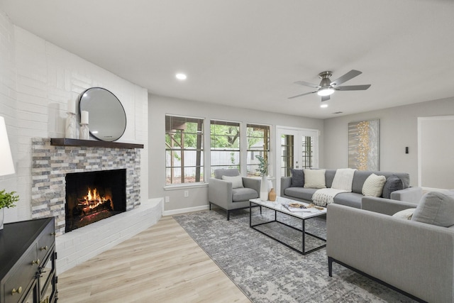 1819 Redwood Ct, Sugar Land, TX 77498 - living area with a ceiling fan, recessed lighting, baseboards, a brick fireplace, and light wood-type flooring