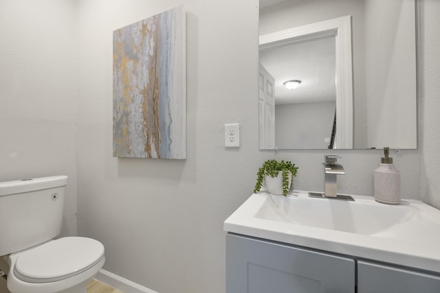 1819 Redwood Ct, Sugar Land, TX 77498 - bathroom with vanity, toilet, and baseboards