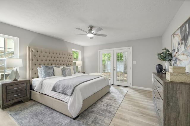 1819 Redwood Ct, Sugar Land, TX 77498 - bedroom featuring a textured ceiling, baseboards, ceiling fan, light wood-style flooring, and access to outside