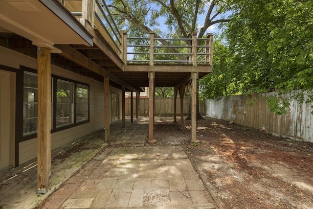 1819 Redwood Ct, Sugar Land, TX 77498 - view of patio featuring a wooden deck and a fenced backyard