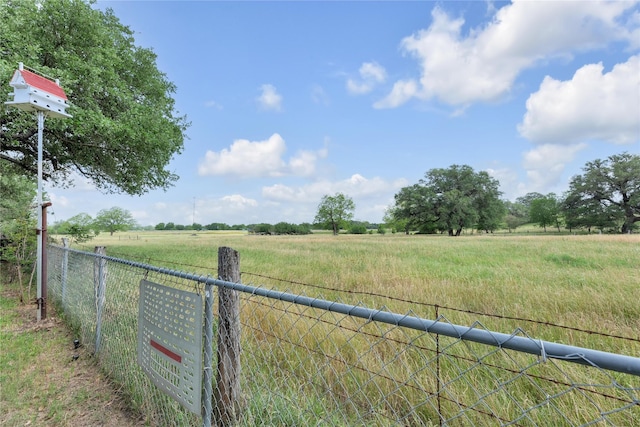 view of yard featuring fence and a view of countryside