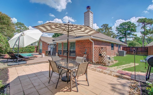 14022 Cypress Falls Dr, Cypress, TX 77429 - view of patio / terrace with central AC and outdoor dining space