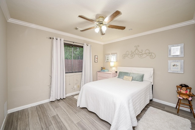 14022 Cypress Falls Dr, Cypress, TX 77429 - bedroom with wood finished floors, baseboards, crown molding, and a ceiling fan