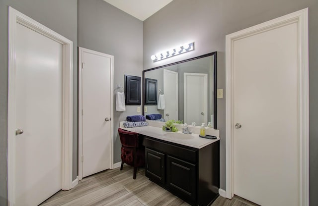 14022 Cypress Falls Dr, Cypress, TX 77429 - bathroom with vanity, wood finished floors, and baseboards
