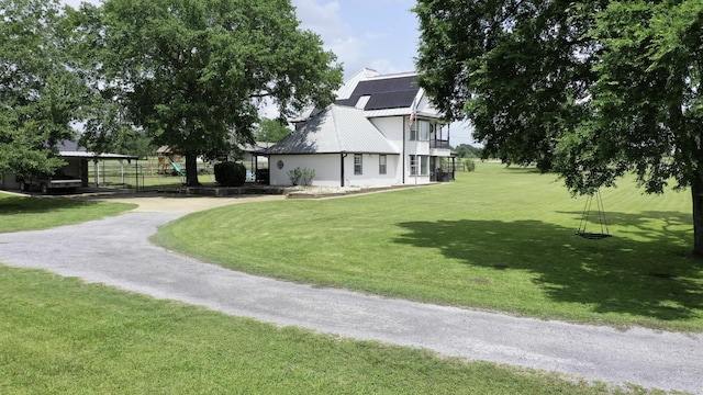 1985 Eastridge Ln, Madisonville, TX 77864 - view of yard with a carport and driveway