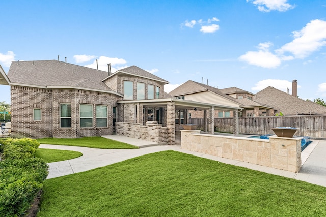 16202 Coyote Run Ln, Cypress, TX 77433 - back of property with a patio, brick siding, area for grilling, and roof with shingles