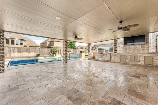 16202 Coyote Run Ln, Cypress, TX 77433 - fenced backyard with exterior kitchen, ceiling fan, and a patio area