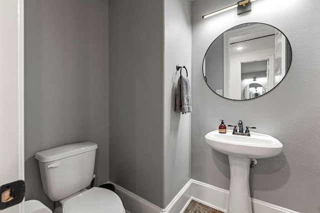 16202 Coyote Run Ln, Cypress, TX 77433 - bathroom featuring toilet and wood finished floors