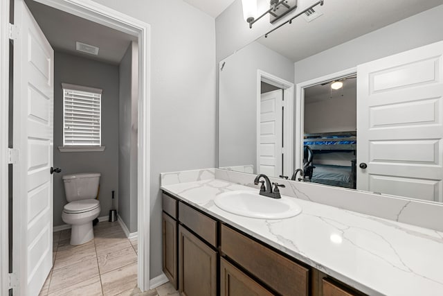 16202 Coyote Run Ln, Cypress, TX 77433 - bathroom featuring vanity and toilet