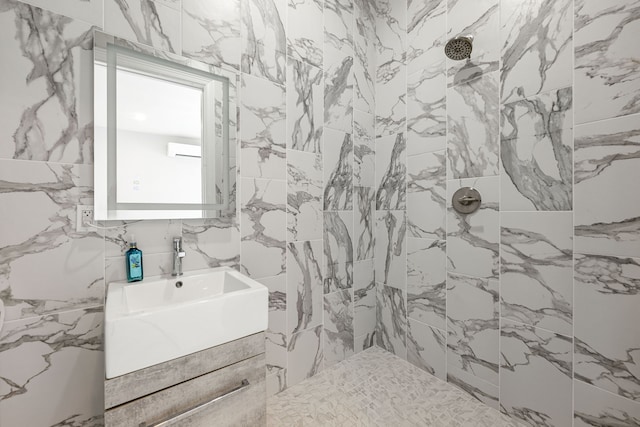 16202 Coyote Run Ln, Cypress, TX 77433 - full bathroom with tiled shower, vanity, and tile walls