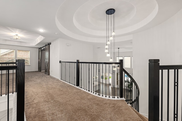 16202 Coyote Run Ln, Cypress, TX 77433 - hall with a raised ceiling, carpet flooring, an upstairs landing, a barn door, and recessed lighting