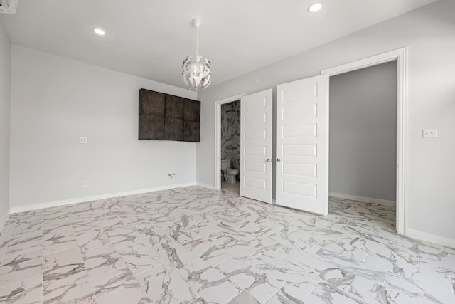 16202 Coyote Run Ln, Cypress, TX 77433 - unfurnished bedroom with recessed lighting, light marble finish floors, a chandelier, and connected bathroom