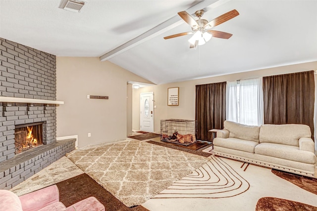 living room with a brick fireplace, lofted ceiling with beams, a ceiling fan, and visible vents