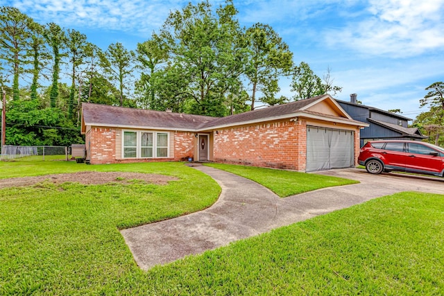 single story home with driveway, brick siding, fence, a garage, and a front lawn