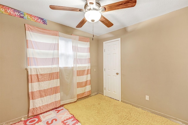 unfurnished bedroom with baseboards and a ceiling fan