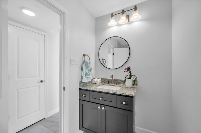 bathroom featuring baseboards and vanity