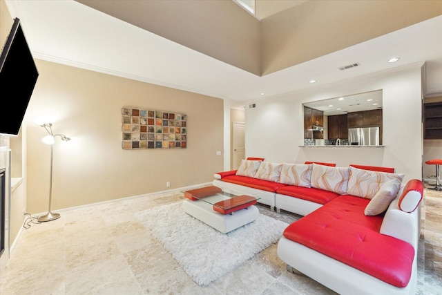 living room featuring recessed lighting and baseboards
