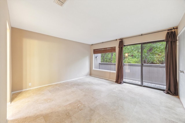spare room featuring baseboards