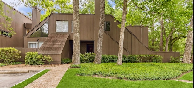 179 Litchfield Ln, Houston, TX 77024 - view of front of home featuring a chimney