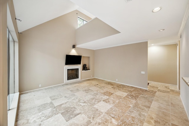 179 Litchfield Ln, Houston, TX 77024 - unfurnished living room featuring a glass covered fireplace, light stone finish flooring, recessed lighting, baseboards, and ornamental molding