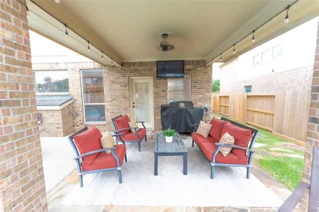 view of patio / terrace with outdoor lounge area, fence, and grilling area