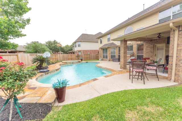 view of pool with a fenced backyard, a patio area, and a pool with connected hot tub