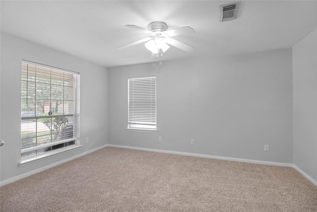 21618 Falvel Lake Dr, Spring, TX 77388 - empty room featuring ceiling fan, carpet floors, baseboards, and visible vents