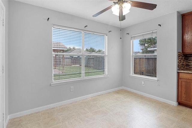 21618 Falvel Lake Dr, Spring, TX 77388 - unfurnished dining area with baseboards and ceiling fan