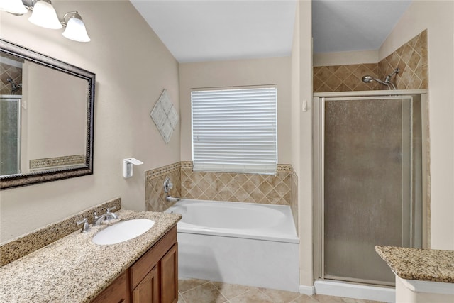 21618 Falvel Lake Dr, Spring, TX 77388 - full bathroom featuring tile patterned floors, vanity, a shower stall, and a bath