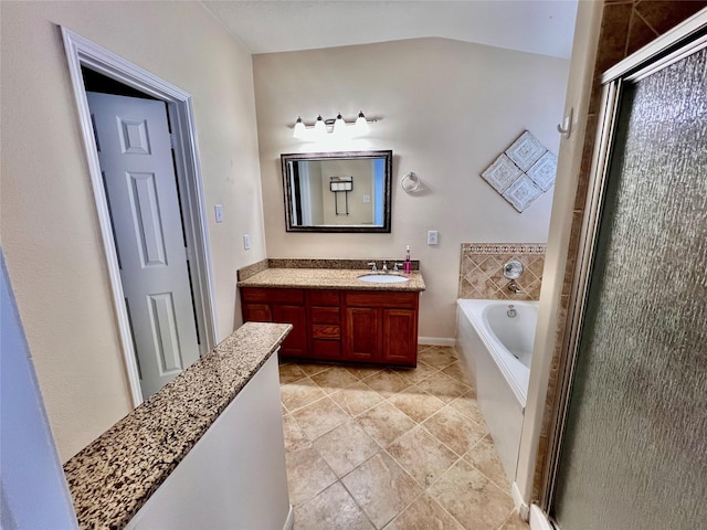 21618 Falvel Lake Dr, Spring, TX 77388 - full bathroom with a stall shower, a garden tub, vanity, and vaulted ceiling
