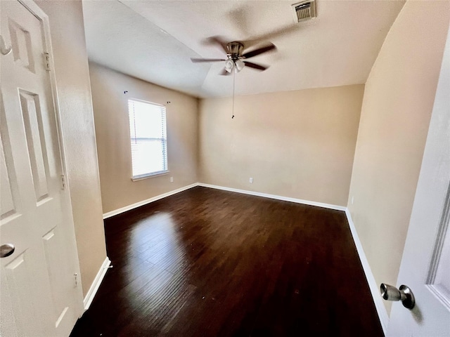 21618 Falvel Lake Dr, Spring, TX 77388 - unfurnished room with baseboards, ceiling fan, dark wood finished floors, and visible vents