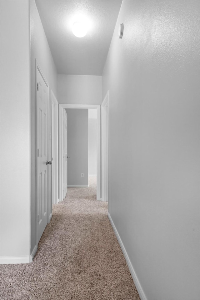 21618 Falvel Lake Dr, Spring, TX 77388 - hallway featuring carpet flooring and baseboards