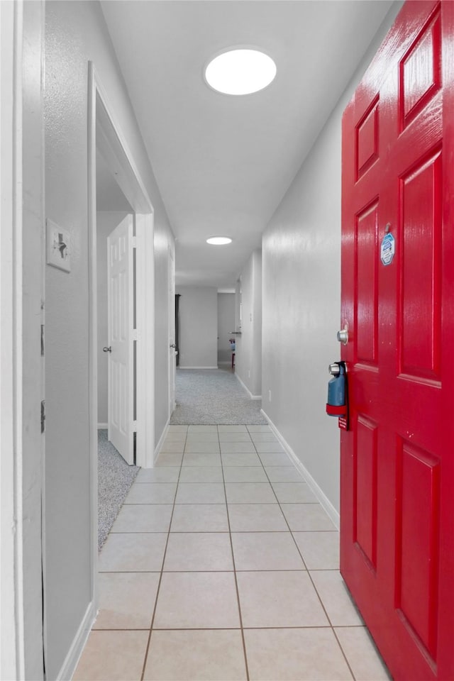 21618 Falvel Lake Dr, Spring, TX 77388 - hall with baseboards and tile patterned floors