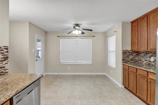 21618 Falvel Lake Dr, Spring, TX 77388 - kitchen featuring brown cabinetry, backsplash, a ceiling fan, and dishwasher