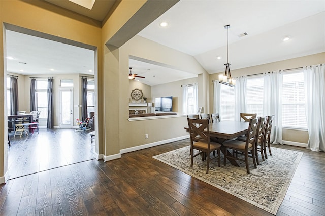 dining space featuring baseboards, a healthy amount of sunlight, visible vents, and dark wood-type flooring