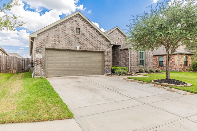 view of front facade with a garage, fence, a front lawn, concrete driveway, and brick siding
