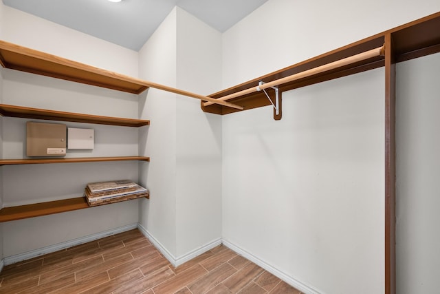 spacious closet featuring wood tiled floor