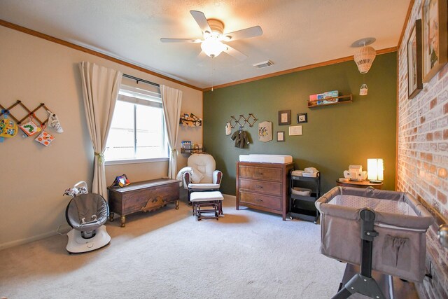 living area with carpet flooring, ceiling fan, ornamental molding, and baseboards