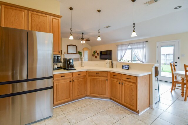 kitchen featuring freestanding refrigerator, ceiling fan, light tile patterned floors, and light countertops