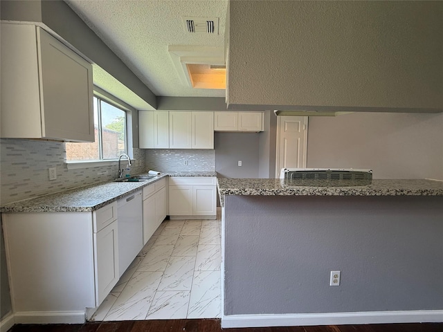 8715 Belle Glen Dr, Houston, TX 77099 - kitchen featuring a sink, dishwasher, light marble finish floors, white cabinetry, and tasteful backsplash