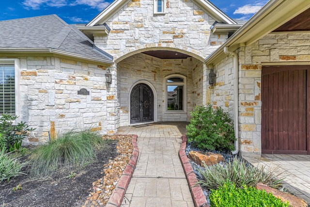 1006 Cross Hollow Ln, Katy, TX 77494 - entrance to property with roof with shingles and stone siding