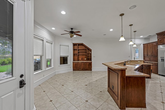 1006 Cross Hollow Ln, Katy, TX 77494 - kitchen featuring crown molding, built in refrigerator, a ceiling fan, and light tile patterned floors