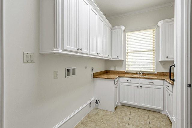 1006 Cross Hollow Ln, Katy, TX 77494 - laundry area featuring light tile patterned floors, gas dryer hookup, crown molding, cabinet space, and electric dryer hookup